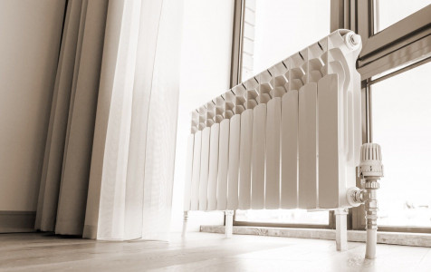 white-big-radiator-near-window-modern-room-sepia-toning.jpg