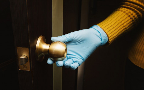 female-hand-protective-glove-open-door.jpg